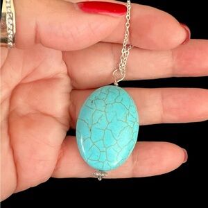 Large oval Turquoise pendant set in silver